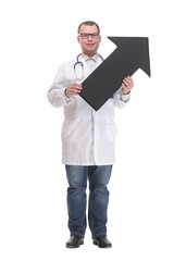 Front view of young smiling doctor holding a black arrow pointing right
