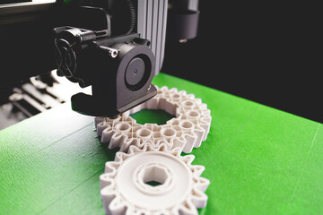 print head, bright green print bed and white helical gears with visible infill and layer. opblique...