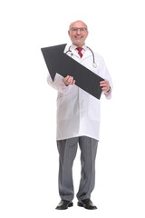 Mature doctor holding a black arrow pointing right isolated on white background