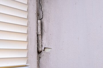 Peeling old paint on window slopes needed to be repared and repainted, reconstruction concept