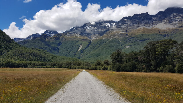 Gravel road through mountain valley and LOTR Isengard viewpoint, Paradise, New Zealand