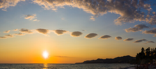 Amazing sea sunset, the sun, waves, clouds