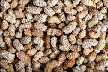 Dried mulberry fruits background and texture,top view