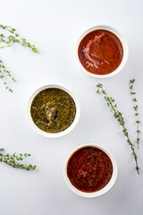 Set of different sauces for barbecue, tomato sauce on white background copy space