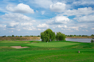 Obraz premium landscape. golf course and sky with clouds. lawn grass.