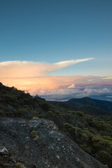 vertical shot of sunrise surrounded by rocks and paramo vegetation in Chirripo National Park