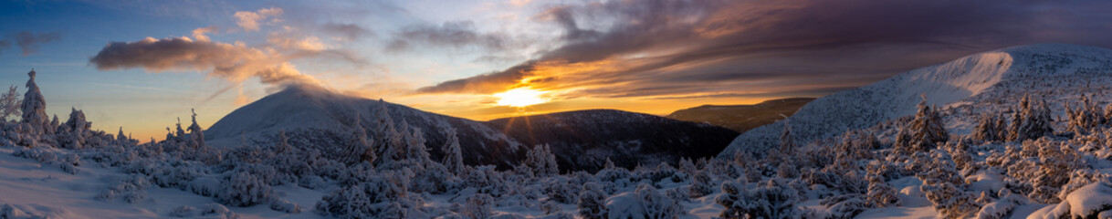 Panorama of the Karkonosze. Sunrise in the Karkonosze. View of Sniezka 