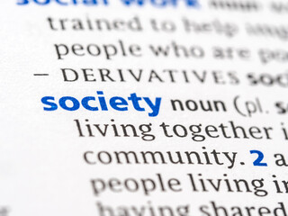 Society - English dictionary definition of the word - photo of a dictionary page with paper grain...