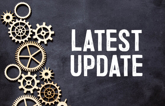 LATEST UPDATE inscription written on book with globe,eyeglasses, calculator.