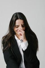 Beautiful middle-aged woman smiling friendly and looking away . Vertical.