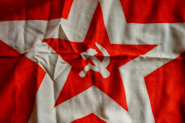 Communist flag with the hammer ants sickle.  - obrazy, fototapety, plakaty