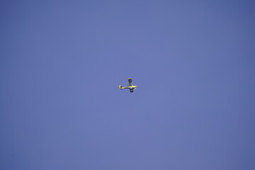 A small motor plane in sky