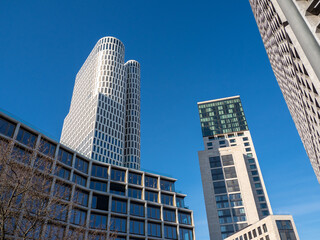 Fototapeta na wymiar Tall buildings against the blue sky.