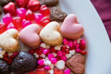 valentines dessert with macarons, candies and chocolate 