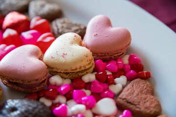 valentines dessert with macarons, candies and chocolate 