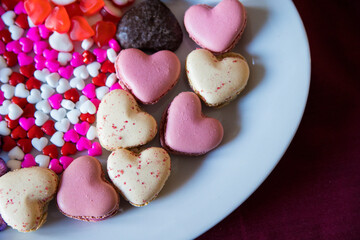 valentines dessert with macarons, candies and chocolate 