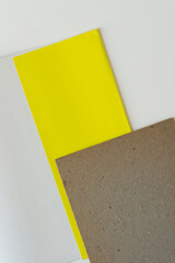 lemon yellow paper and mill board on paper
