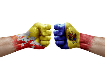 Two hands punch to each others on white background. Country flags painted fists, conflict crisis concept between bhutan and moldova