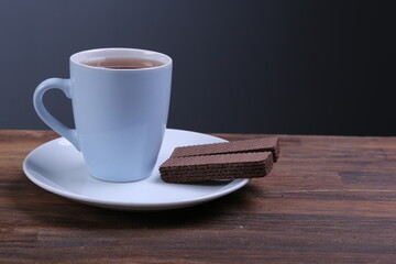 Chocolate Wafer on Wooden Plate, Served with Tea, Copy Space
