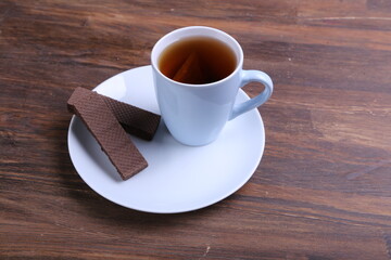 Chocolate Wafer on Wooden Plate, Served with Tea, Copy Space