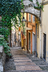 A typical uphill alley of the old town, called "La Pigna" (the pine cone) for the characteristic shape of its streets and fortifications, Sanremo, Imperia, Liguria, Italy