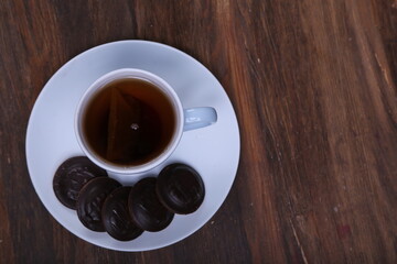 Image of ivory tea cup with sweet heart shaped cookie