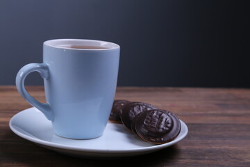 Image of ivory tea cup with sweet heart shaped cookie