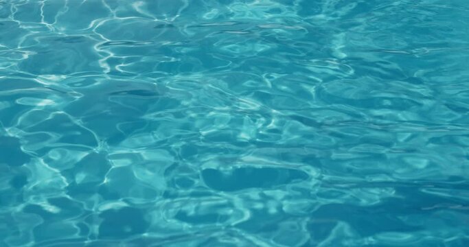 The surface of the water in the pool.