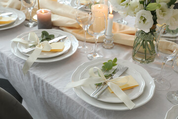 Festive table setting with beautiful floral decor in restaurant