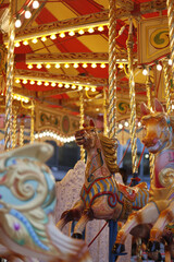 A vertical shot of a horse of the merry-go-round in an amusement park