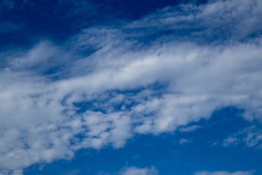 Blue sky and white cloud formations image for background use