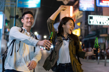 Asian attractive couple drinking alcohol and having party together. 