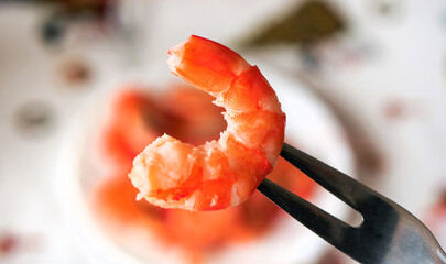 Delicious boiled shrimp on the fork