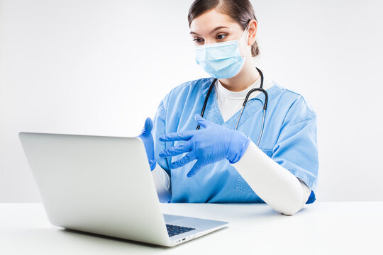 UK NHS GP Doctor Chatting To Patient Over Computer