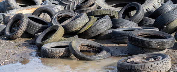 Old used tires from cars and trucks. Ready for rubber recycling or disposal