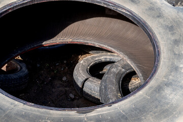 Old used tires from cars and trucks. Ready for rubber recycling or disposal