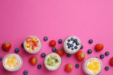Jars of fresh yogurt and different fruits on pink background, flat lay. Space for text