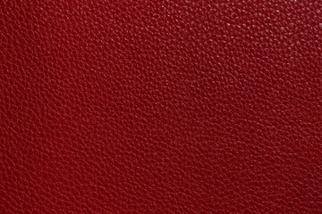 Luxury red leather sample close-up. Can be used as background. Industry background.