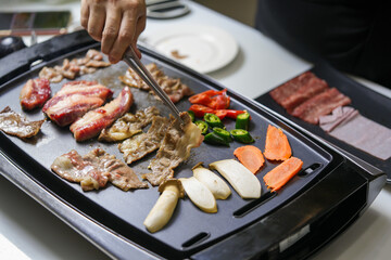 Korean beef barbecue a popular Korean dish with vegetables, green pepper, red pepper, carrot and masroon barbecue. 