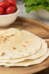 Making delicious and healthy wrap sandwich .