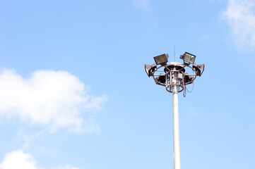 Spotlights illuminate the park at night.