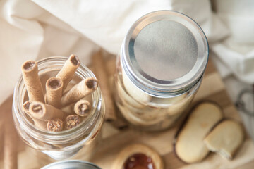 Glass mason jars with sweet dessert snacks