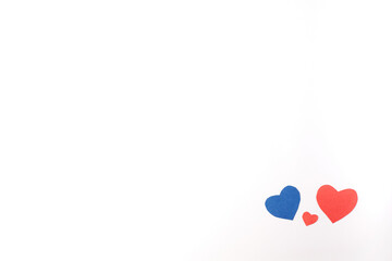 Valentine's Day. Red and blue heart made of paper on a white background. Top view. Copy space. Place for text.