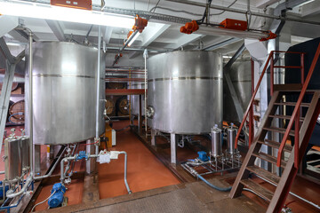 Metal tanks for making alcohol drinks in light workshop