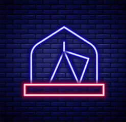 Glowing neon line Tourist tent icon isolated on brick wall background. Camping symbol. Colorful outline concept. Vector