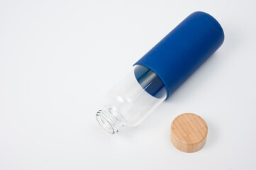 Stylish glass water bottle with wooden lid. For fitness and travel.