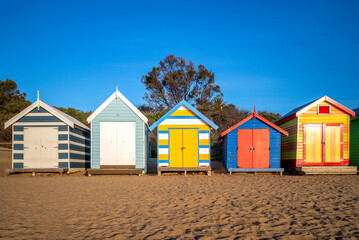 Fototapeta na wymiar December 27, 2018: Brighton Bathing Boxes at Brighton Beach in Melbourne, Australia. These boxes were built more than 100 years ago to Victorian notions of morality when it came to seaside bathing.