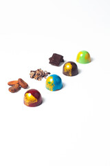 mexican Colorful chocolate candy bonbons and ingredients on white background