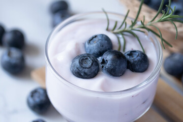 Fresh blueberry yogurt in a clear glass