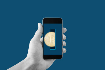 Bitcoin wallet, smart block chain technology. Hand holding mobile smart phone with bitcoin 